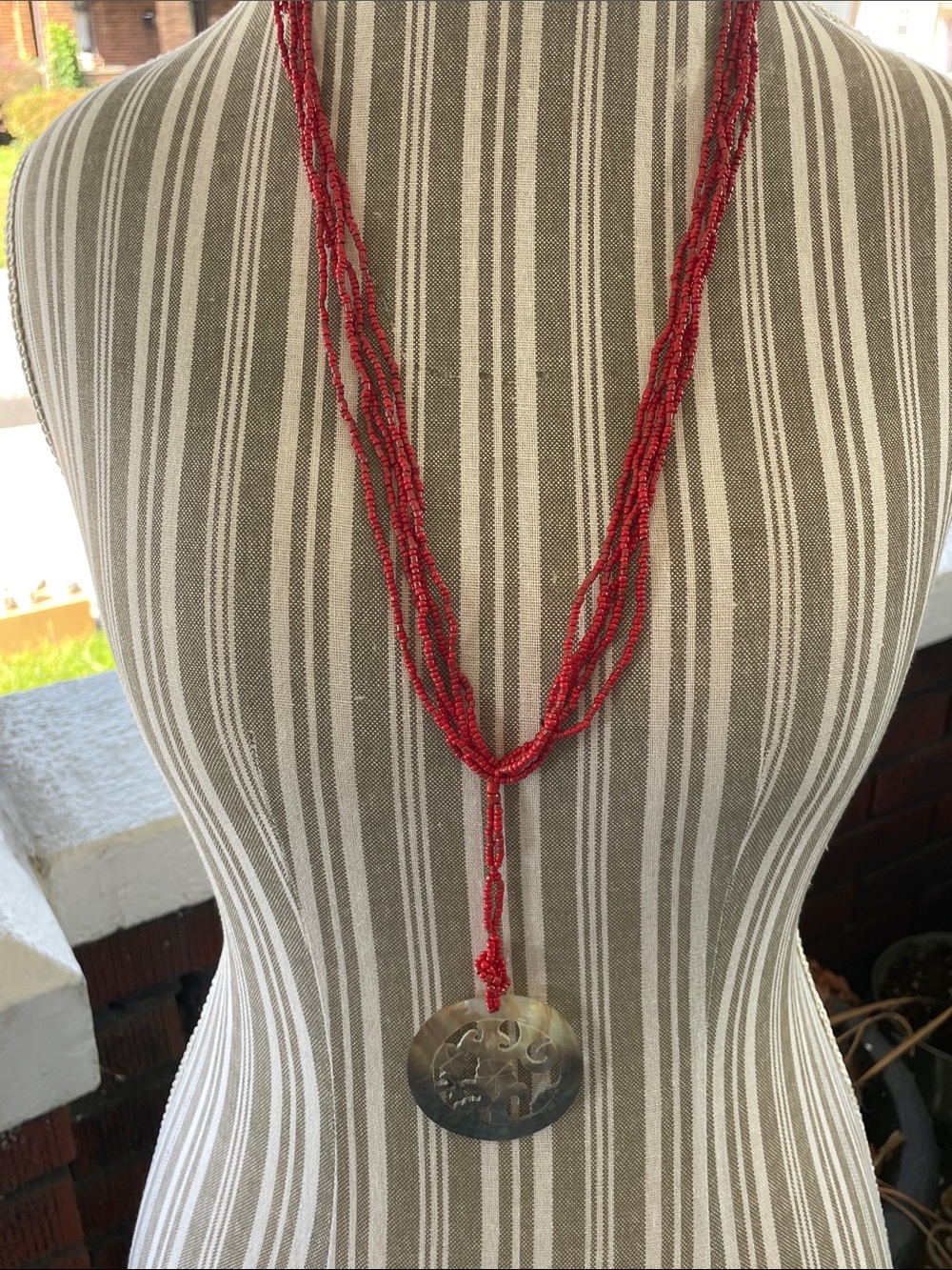 Carved Shell and Coral bead necklace. Purchased in Australia.